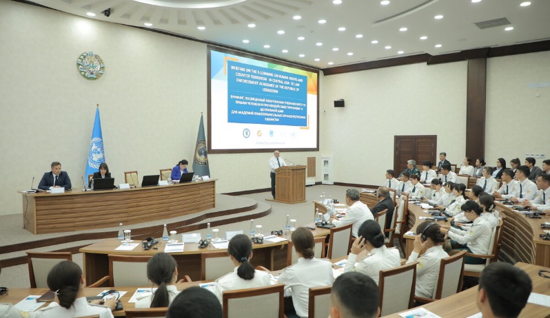 A group of people in a conference room
Description automatically generated