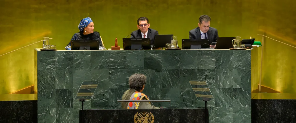 Mia Amor Mottley (at podium), Prime Minister of Barbados, directly addresses Khalilur Rahman (centre at dais), President of the eighty-first session of the UUNGA, saying “And to you, Mr. President, Barbados extends its warm congratulations. We look forward to your stewardship of this assembly, and we move to restore trust and indeed to carry reforms from proposals to implementation”.