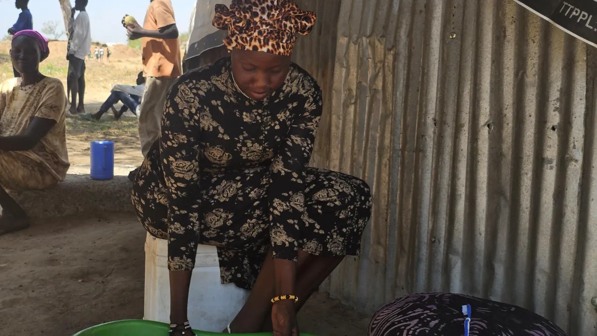 Photograph of young woman in displacement camp