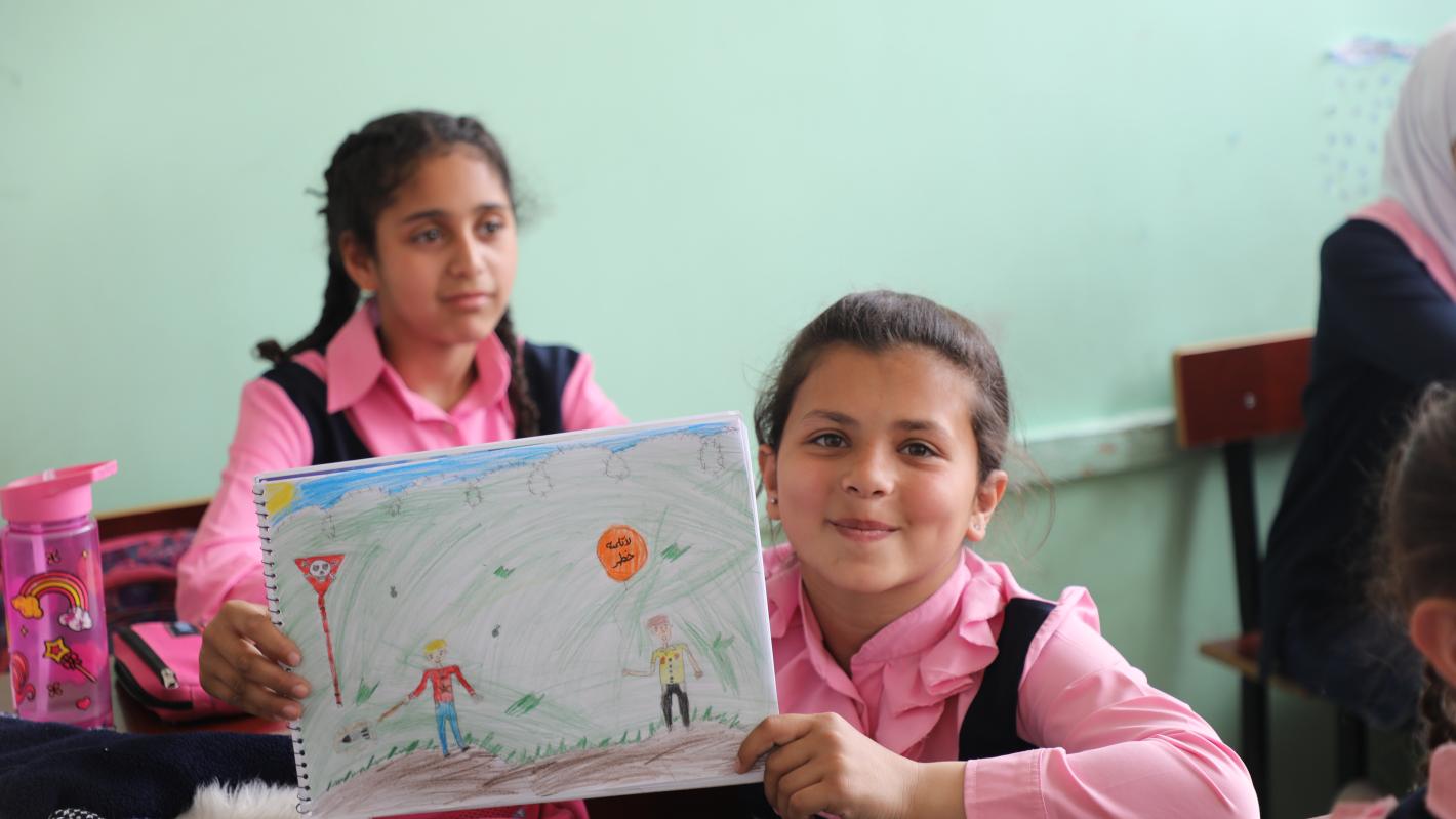 Drawing activity called "painting for peace" at Darraya School in Rural Damascus, focusing on Explosive Ordnance Risk Education. 