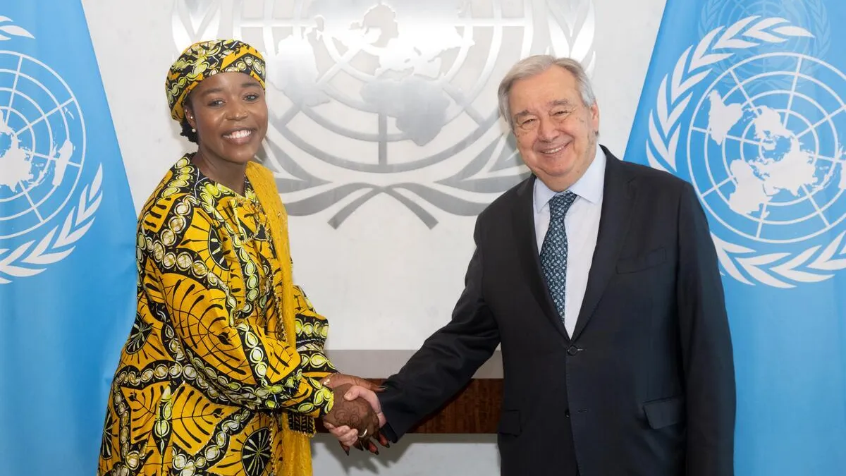 Secretary-General António Guterres (right) shaking hands with Maryam Bukar Hassan, UN Global Peace Advocate.
