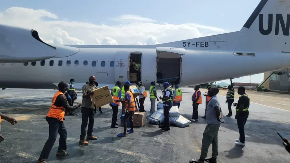 Staff from the mission and WHO receiving equipment at airport