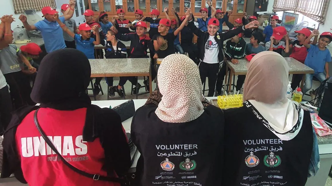 Volunteers conducting EORE to children in Palestine