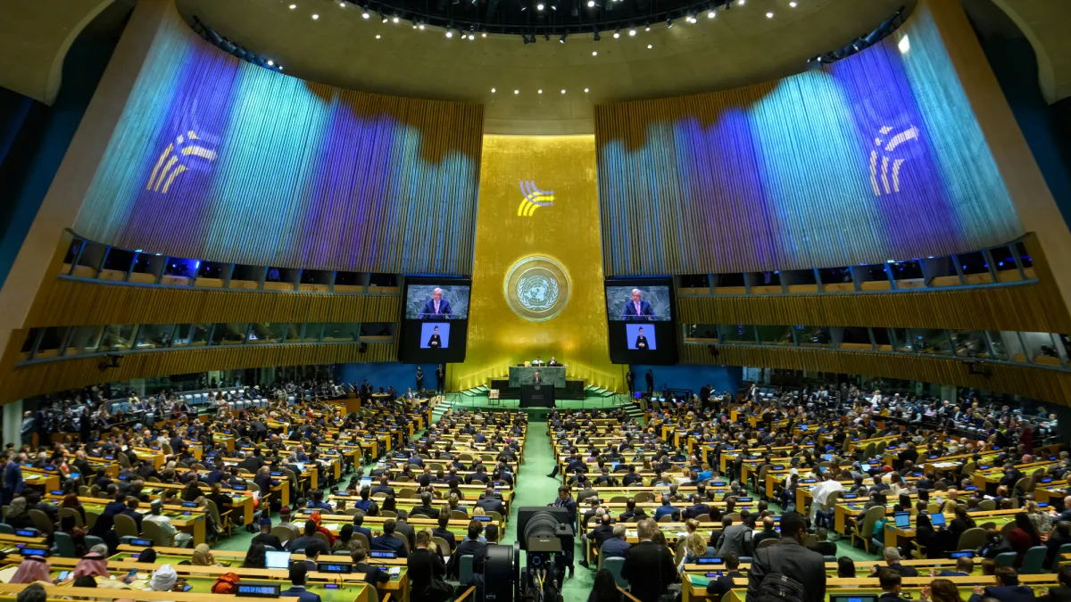 A wide view of the General Assembly Hall as Secretary-General António Guterres (at podium and on screens) addresses the opening of the Summit of the Future.