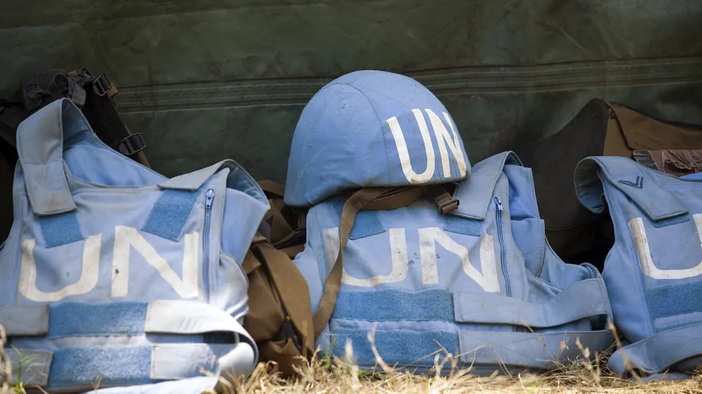 A blue helmet and empty protective gear.