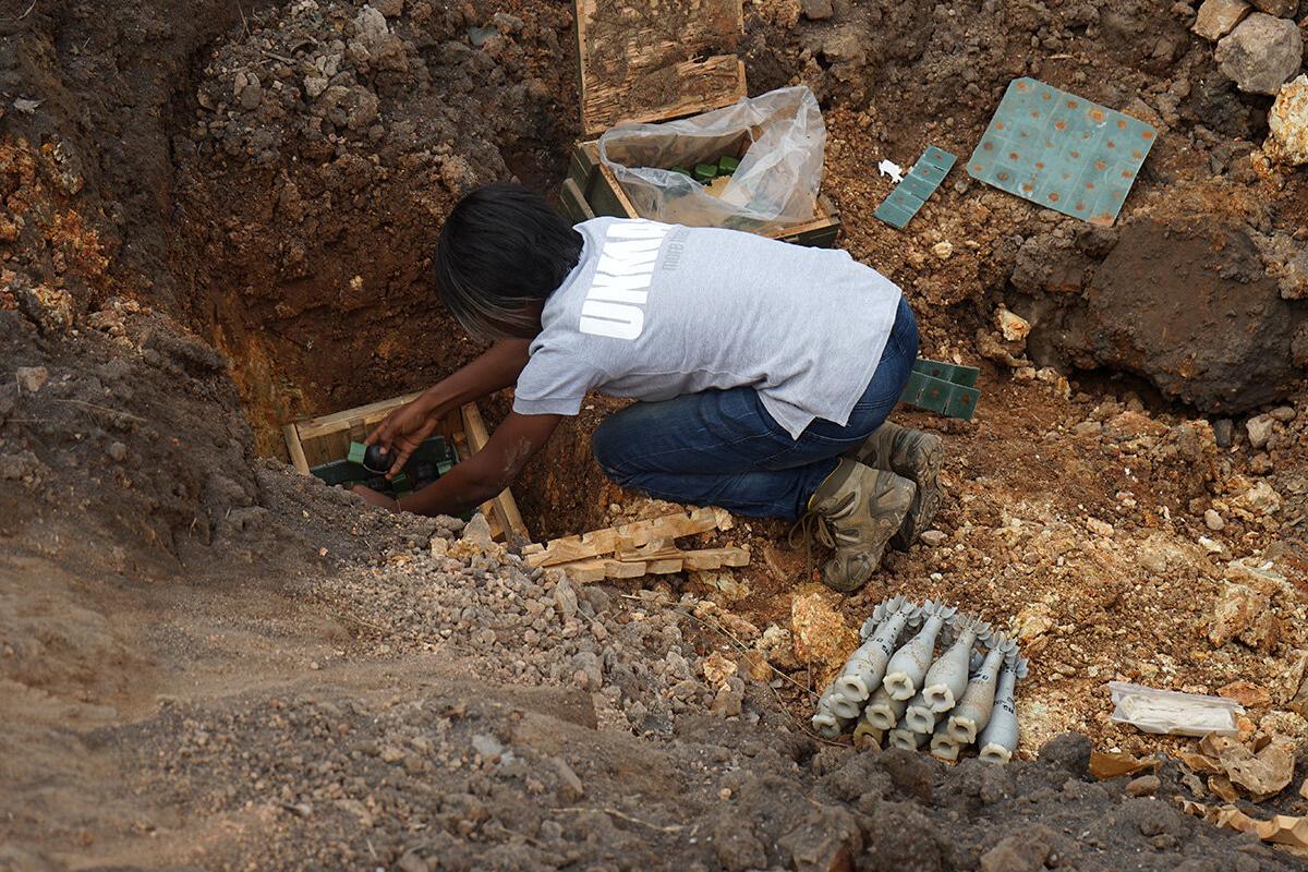 a woman is working in a field