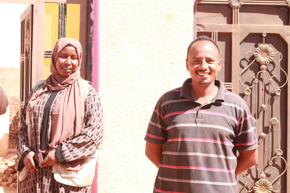 Mr. and Mrs. Ibrahim smile, relieved from the fear of explosive hazard in their yard Mr. and Mrs. Ibrahim smile, relieved from the fear of explosive hazard in their yard