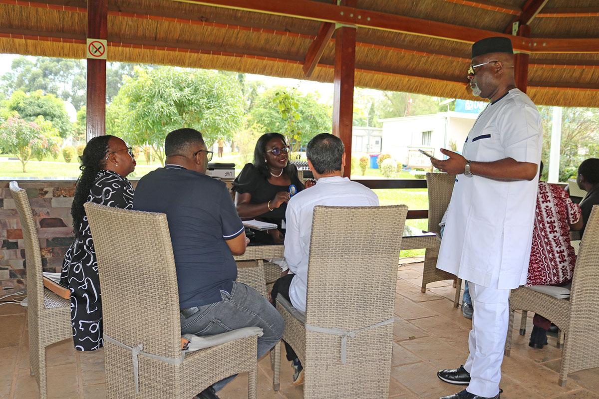 Director RSCE, Mr. Paulin Djomo (standing) talks to Chief LARRMU,  Elise Metougue and some RSCE staff members on the importance of the ISO Awareness Clinic.