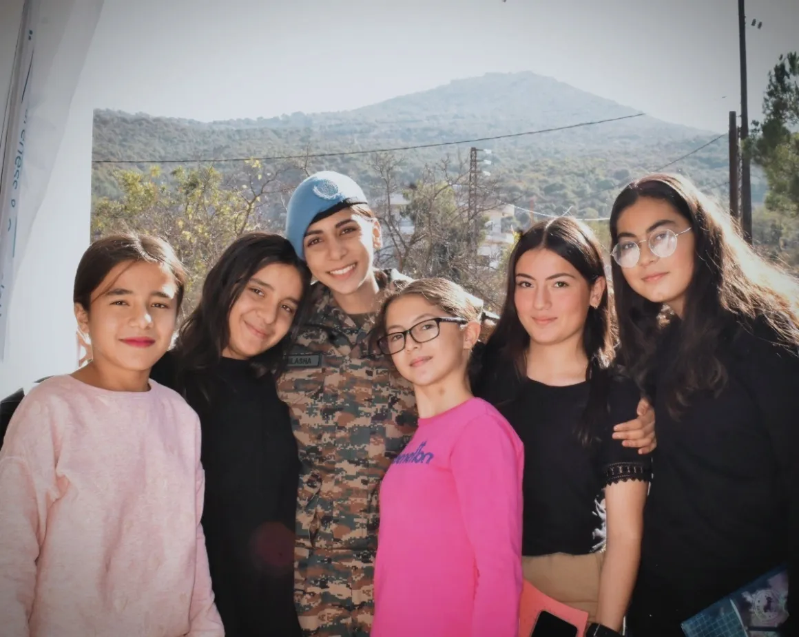 Major Barak with young women in Lebanon.