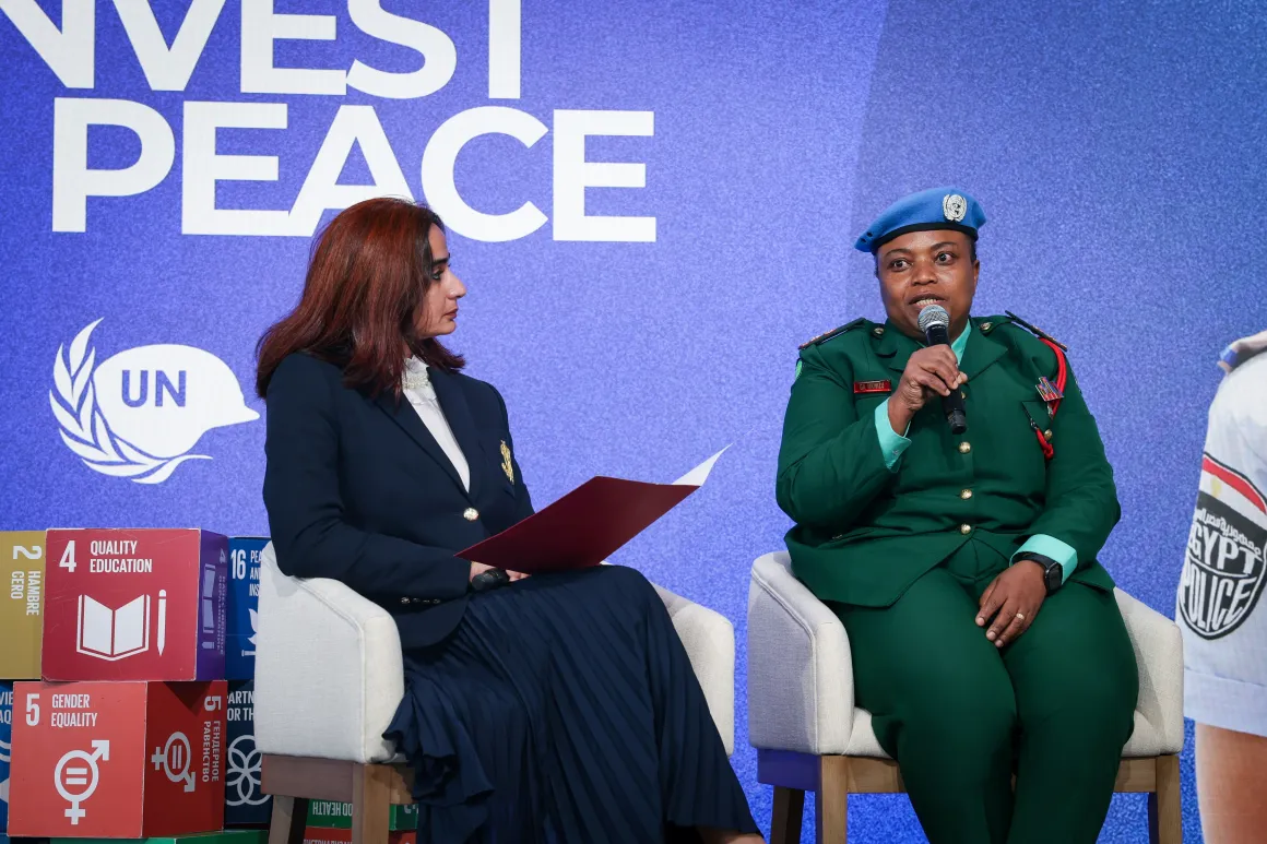 Interviewer speaks with woman peacekeeper