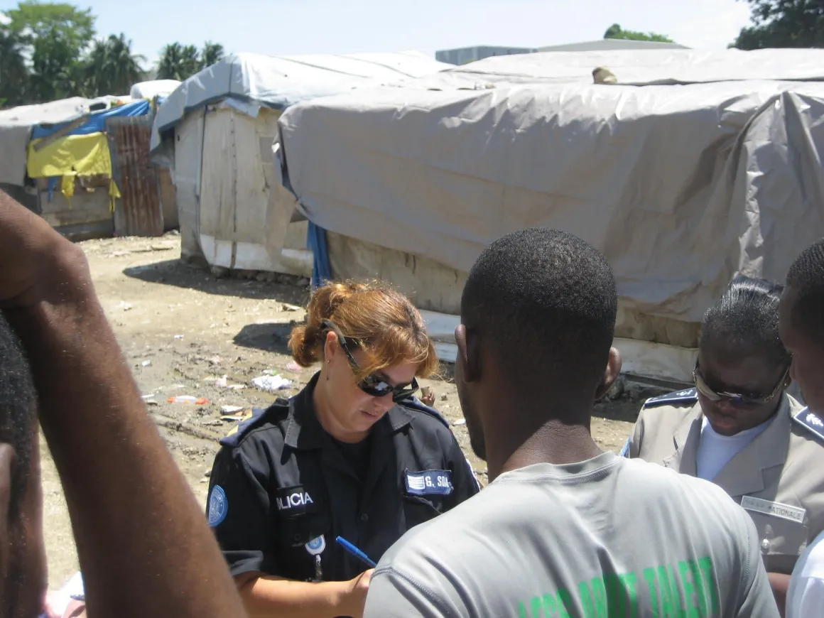 Women police officer speaking with public 