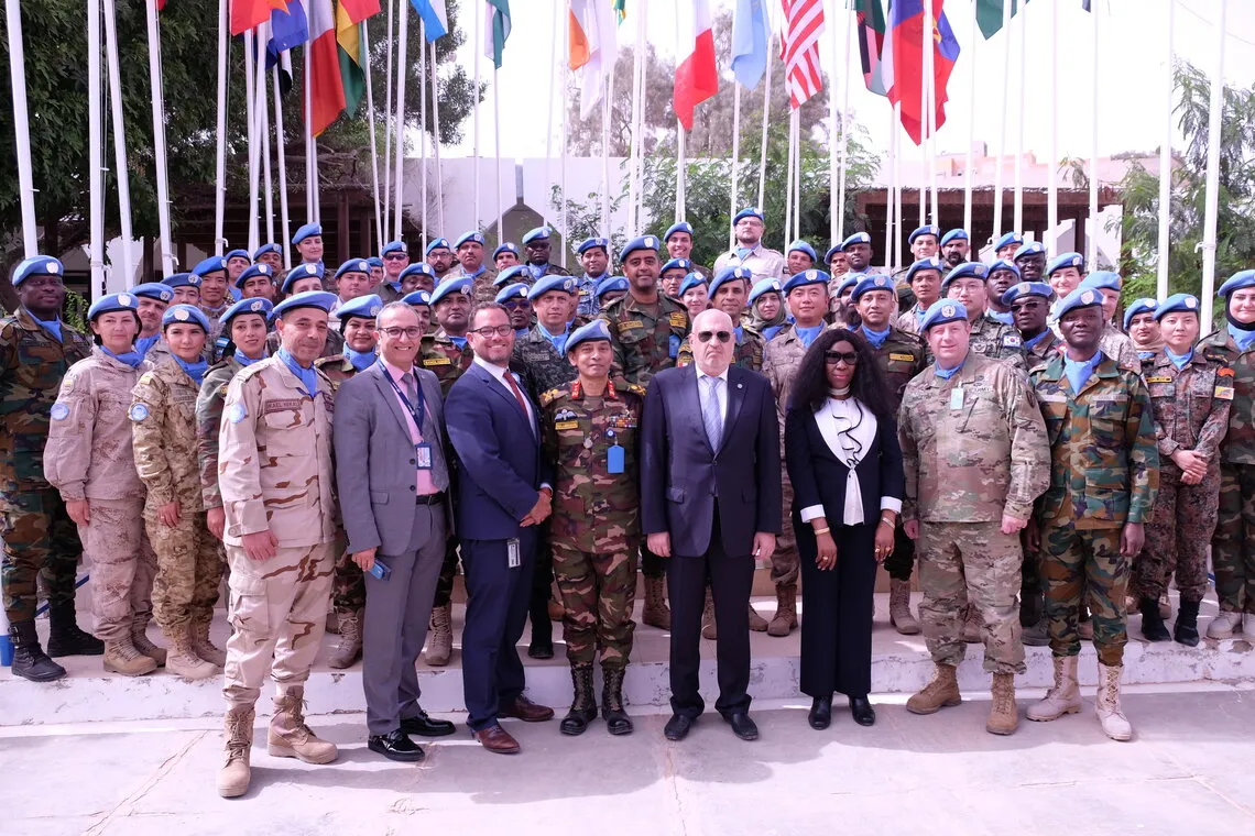 MINURSO Acting Force Commander, Major General Md Main Ullah Chowdhury with the MINURSO team during his farewell ceremony. Photo credit: UN Photo/MINURSO
