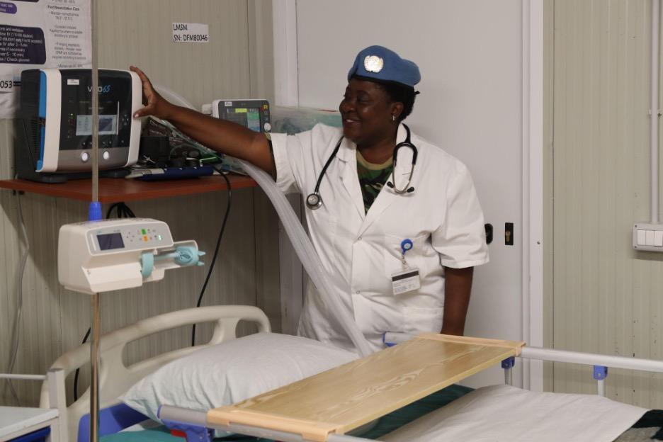 A Theater Nurse inside the Light Mobile Surgical Module checks the equipment.